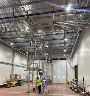 Large industrial facility installation with stainless piping and access systems